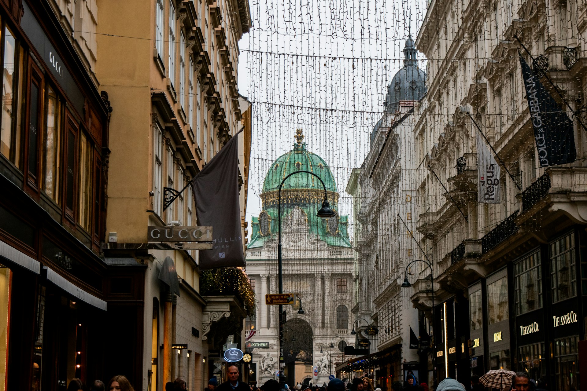 A european street with a domed building ahead.